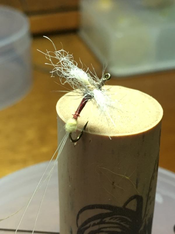 Polar cripple spinner mayfly hooked into a cork