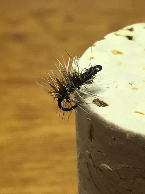 Griffins gnat hooked into a cork