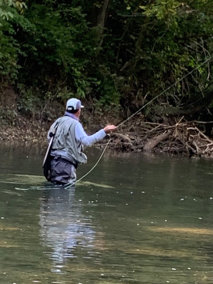 Greg wading in the Mad River casting to a fish