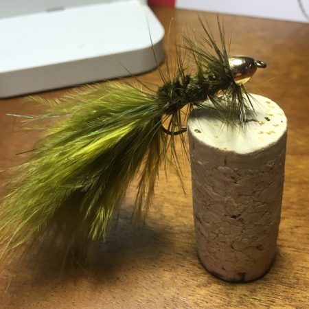 Woolly bugger hooked into a cork